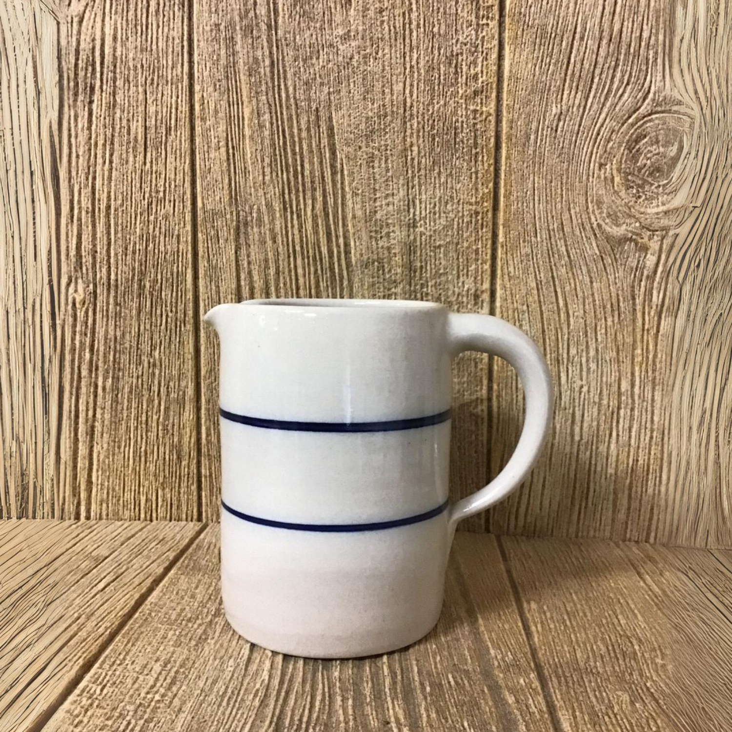 Quarter 1/4 gallon stoneware jug / pitcher with blue stripe handmade in the USA by Martinez pottery - classic country styling and made to last a lifetime